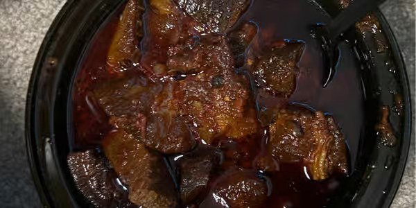 Ata din-din elepo palm oil fried stew with assorted meats