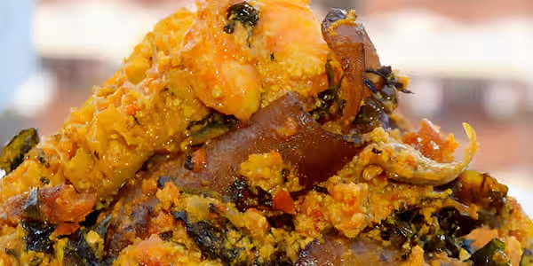 Efo Elegusi melon seed soup with spinach, smoked fish and meat from Foodsleeve