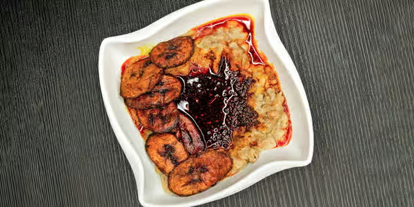 Ewa Agoyin mashed beans with spicy sauce - Lagos street food classic