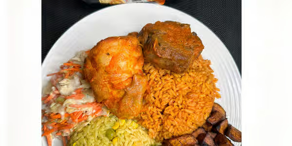 Half jollof rice and half fried rice combo plate at Foodsleeve African Restaurant